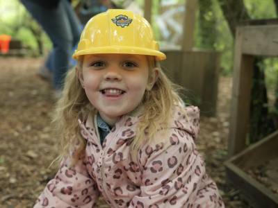 Young girl playing outside at Little Wilds
