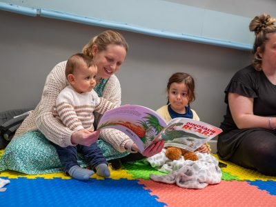 Adults reading to children at Reading Fairy